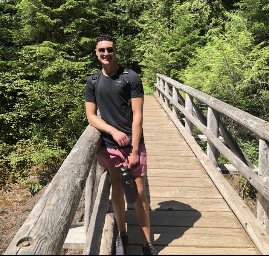Transfer student from Portland State University and current incoming OSU junior Darios Asgari on a bridge over Opal Creek in Oregon. Asgari believes the perspective of transfer students are not as frequently considered compared to traditional four-year degree-seeking students. 