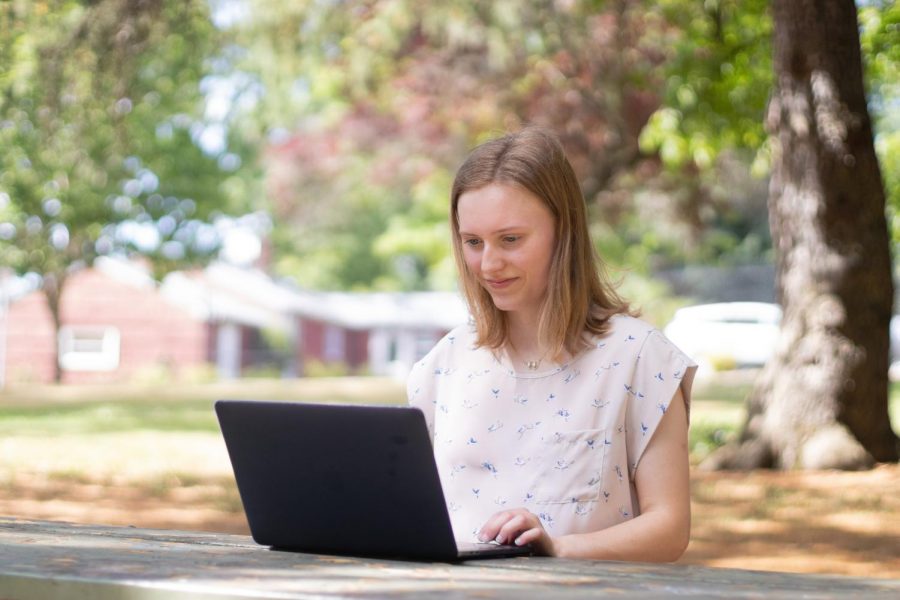 Photo illustration of incoming Freshman Brontë McKinnis using a laptop in her home town of Portland, Ore. After an all remote START experience, Brontë plans to pursue a degree in Engineering at OSU. 