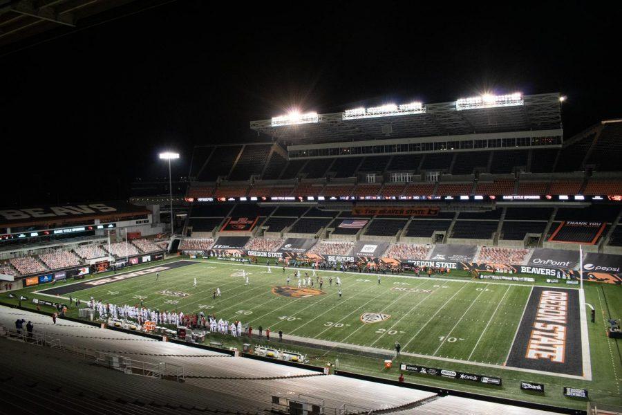 In this file photo from Nov. 7, 2020, Oregon State plays against Washington State while an empty Reser Stadium looms over them. During the 2021 football season, Oregon State will have 5 home games.  