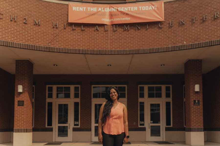 Alumni Association Early Engagement Director Mamta Chowdhury in front of the Alumni Center. The Association provides graduating students with many resources, including connecting them with post-graduates who can provide their expertise.