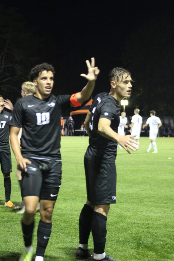 Junior midfielder Sofiane Djeffal, (left), and junior defender Gael Gibert signal to nearby teammates after they scored the final point that put them in the lead against UCLA at Thursday nights game.
