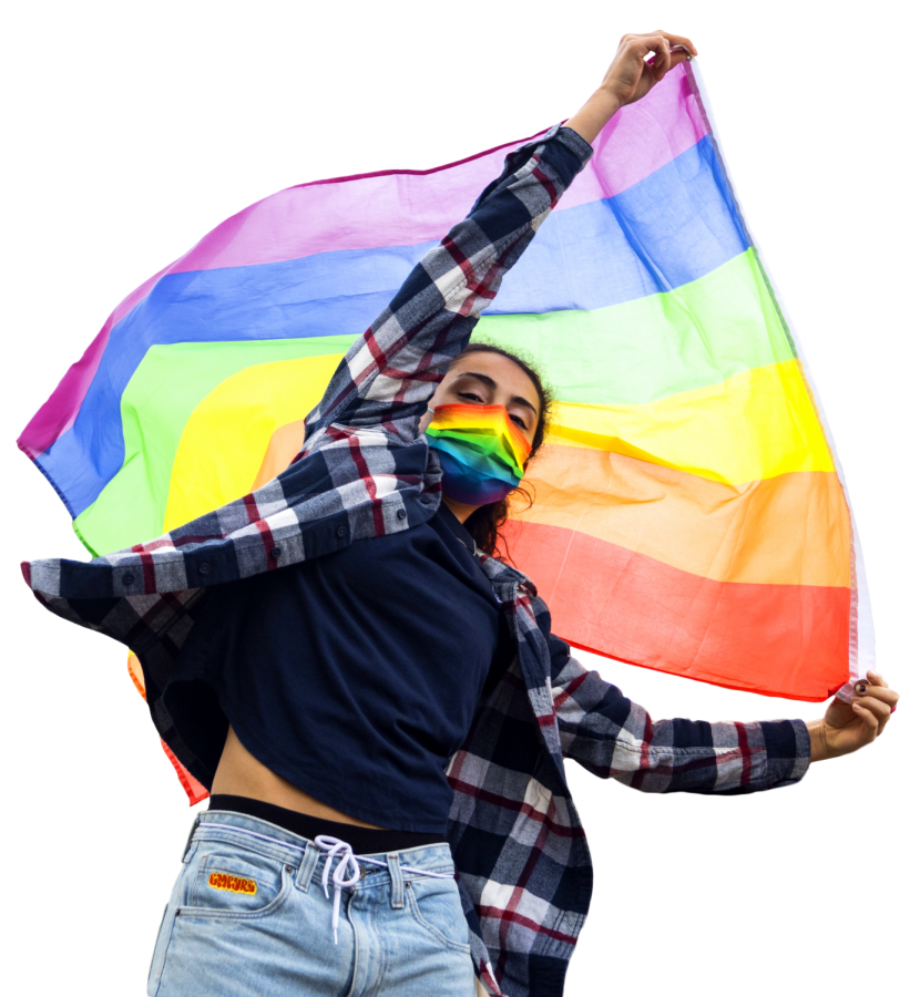 First-year mathematics student Ana Bacon (she/her) waves the Pride flag in front of the Memorial Union on Nov. 14. The Pride Center on Oregon State University’s Corvallis, Ore. campus is celebrating its 20th anniversary this year and was first established in May 2001.