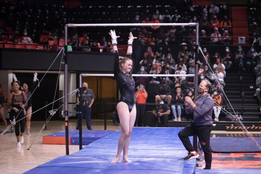 Oregon State freshman gymnasts Carley Beeman sticks a landing on her uneven bars routine in Gil Coliseum on Nov. 20 at the Orange and Black Exhibition. The Orange and Black Scrimmage was the first time fans were allowed at an OSU gymnastics meet since March 24, 2020.  