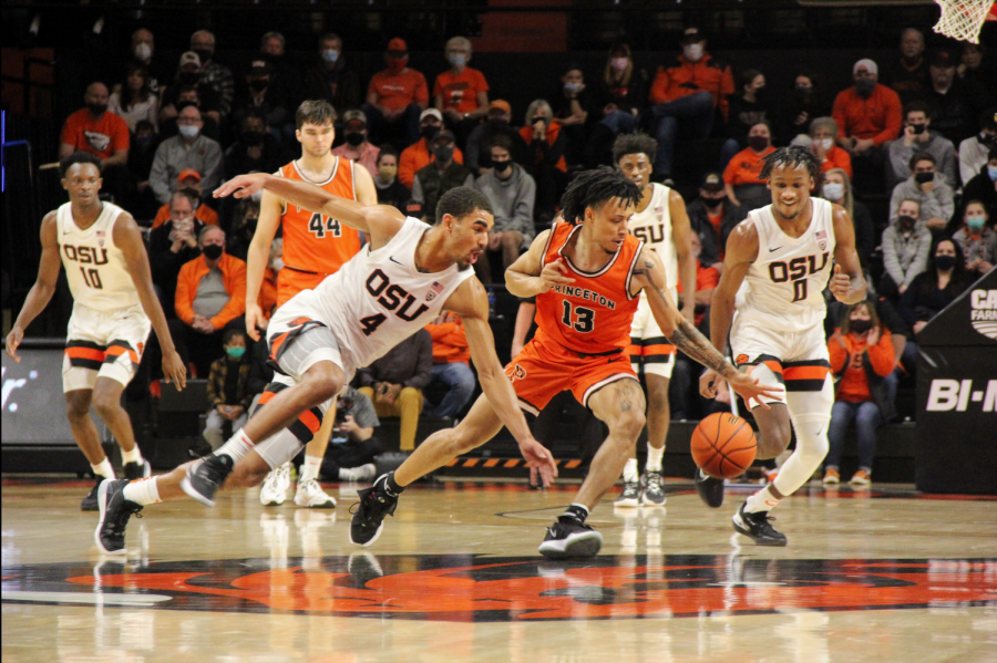 Oregon State junior guard Tre Williams looking to steal the ball from a Princeton basketball player in Gill Coliseum on Nov. 21. While Williams finished with 11 points, going 4-6 in field goals, the Beavers fell to the Tigers by a score of 80-81.  