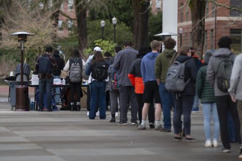 Oregon State University students line up outside at the Student Experience Center plaza on Jan. 6 to receive COVID-19 testing. Students who are not up-to-date with the universitys vaccination requirements are required to do weekly COVID-19 testing.