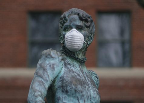 A statue in front of the Strand Agricultural Hall on the Oregon State Univeristy Corvallis, Ore. campus wears a COVID-19 mask. Masking policies at OSU have not changed despite the Oregon Health Authority announcing that mask mandates will be lifted no later than March. 31.