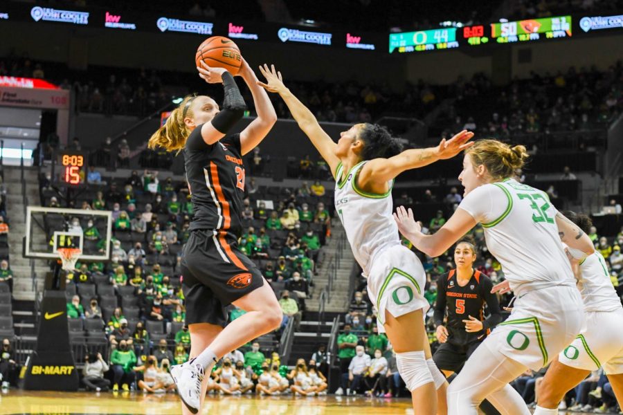 Senior forward Ellie Mack fades away on a jump shot over Oregons defense. Mack went on to score 14 points in the Beavers win.
