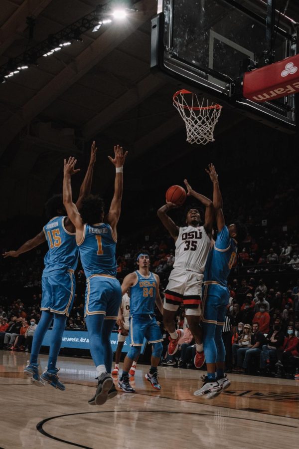 Freshman forward Glenn Taylor Jr. fights his way through the UCLA defense in route to his 10 point performance in 34 minutes. The Beavers lost to UCLA by a score of 94-55.