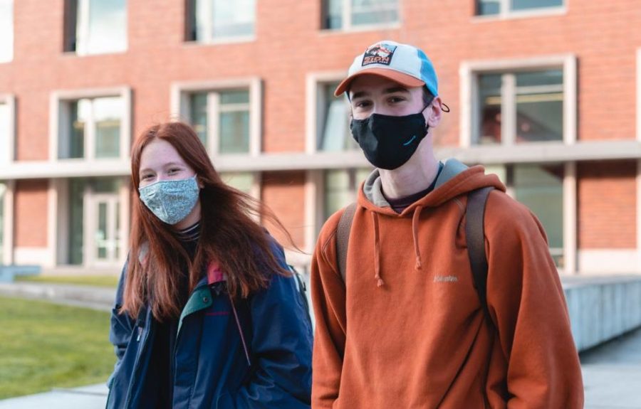 Oregon+State+University+students+Makena+Apau%2C+left%2C+and+Ethan+Thompson+are+wearing+masks+as+they+walk+out+of+the+Learning+Innovation+Center+on+the+Corvallis%2C+Ore.+campus+on+Jan.+31.+OSU+announced+on+Feb.+24+that+it+will+lift+its+mask+mandate+by+March+19+at+the+latest.+