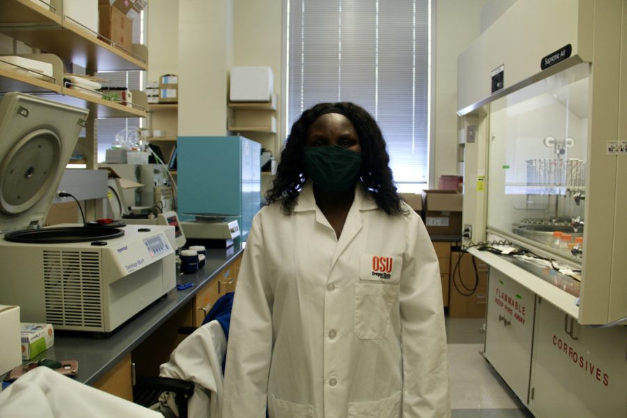 Ruth Muchiri, the research and development lab manager, stands in Van Breemans lab. Van Breeman and his team have found that cannabinoid acids can help block the COVID-19 virus from infecting humans.