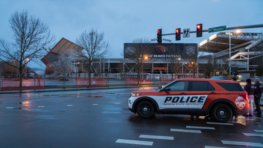 The Corvallis Police Department looks over the implosion of the west side of Reser Stadium on Jan. 7, 2022. The renovation is planned to be finished in November 2023, and home games will still be played in Reser for the 2022 season.