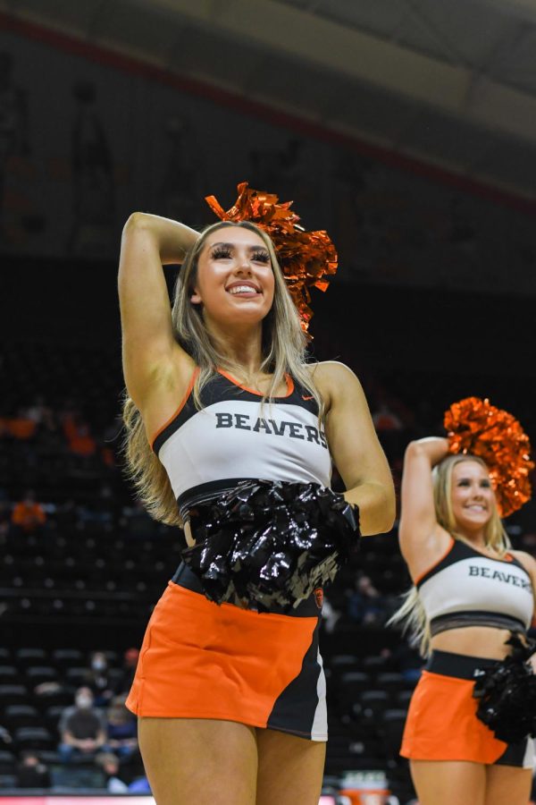 Oregon State dancer Sarah Kurd cheers for Oregon State’s Men’s Basketball team when they faced off against the University of California Golden Bears on Feb. 9. Like other OSU athletic programs, the OSU dance team has a schedule of games where they will make appearances. 