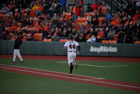 Oregon State sophomore infielder Garret Forrester walks to first base against the University of Washington Huskies on April 22 at Goss Stadium. Forrester would later hit the single that allowed teammate Travis Bazzanna to score the last run needed to win against the Huskies 4-3.

