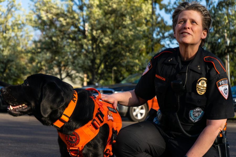 Shanon Anderson, the chief of police and associate vice president for public safety, and Cedar, the wellness dog for the Oregon State University Corvallis, Ore. campus, pose together outside the campus dispatch center on April 6. According to Anderson, the OSU police department can provide medical assistance until their partners from the Corvallis Fire Department arrive.