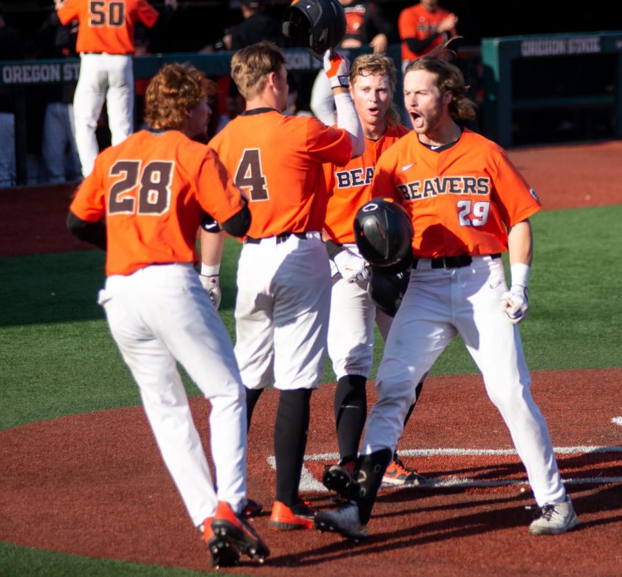 The Oregon State baseball team celebrating after Oregon State junior infielder Jacob Melton's home-run against the UCLA Bruins on May 20 at Goss Stadium. The Beavers would lose the game by a score of 7-4, and dropped to an overall record of 40-13