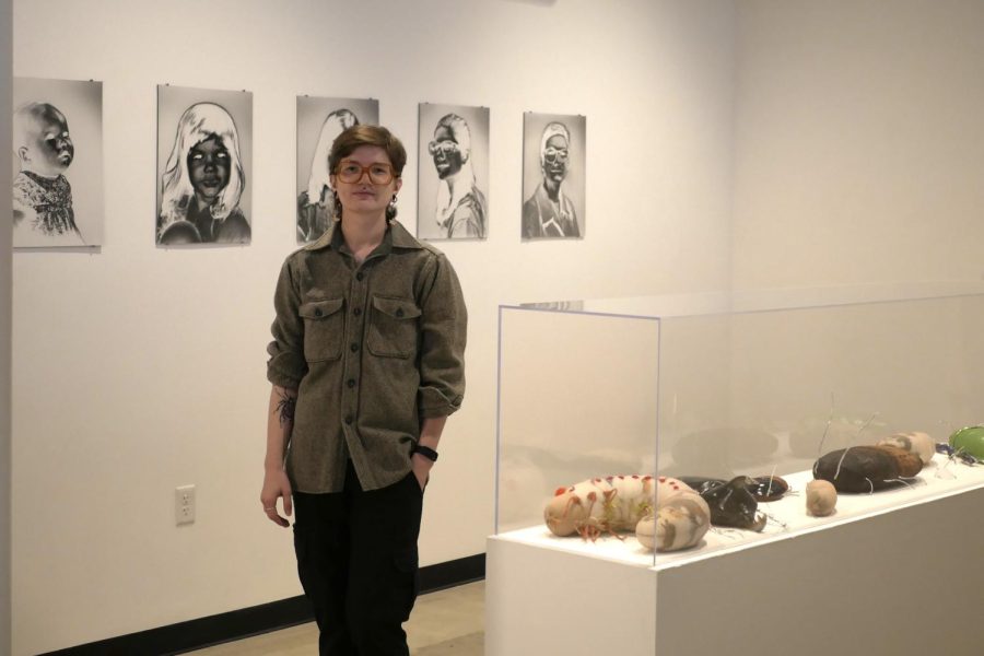 Lee Niemi, a studio art major, presents his work and artist statement in the Senior Art Exhibit on April 13 in Snell Hall. He aims to share his experiences being trans through themes of transition and memory as a sculptor and photographer.
