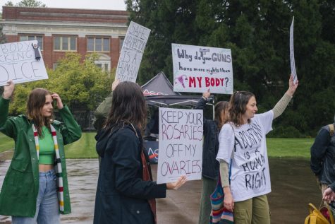 Organizers gather with various signs for a walkout in the Memorial Union quad on Oregon State Universitys Corvallis, Ore. campus on May 5. The walkout was held in response to a leaked draft decision that the Supreme Court will be overruling Roe v. Wade, which was a landmark decision stating the U.S. Constitution protects a womens choice to have an abortion.