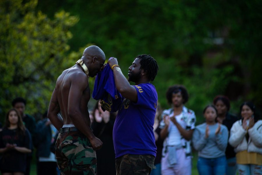 Omega Psi Phi inductee Adigun “Ωba” McLeod, officially becomes a brother as OPP brother Le'Waski Watkins puts on the Psi Phi colors on Mcleod during the OSU Probate in the Memorial Union Quad on May 20. Omega Psi Phi is part of the National Pan-Hellenic Council, or Divine Nine, which will be performing during the Lonnie B. Harris Black Cultural Center block party on June 1. 