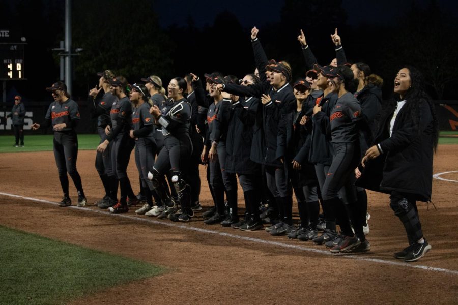 The Beaver softball team chant the Oregon State fight song to the crowd after winning their first game of the series against the Arizona Wildcats inside Kelly Field, April 8.