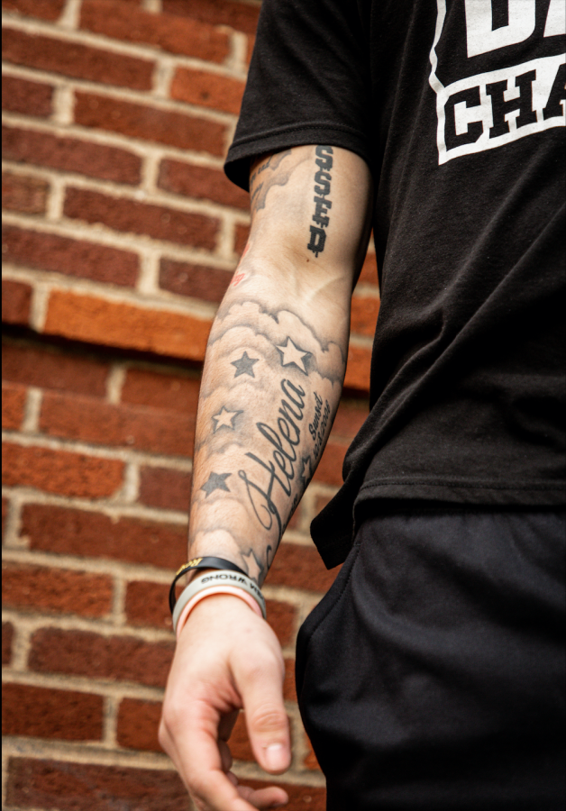 Oregon State redshirt-junior defensive back Alton Julian shows off his tattoo in front of Weather- ford Hall on March 24. Julian, along with several other OSU football players, has been featured in
the Inked series, which allows them to tell the stories behind their tattoos.