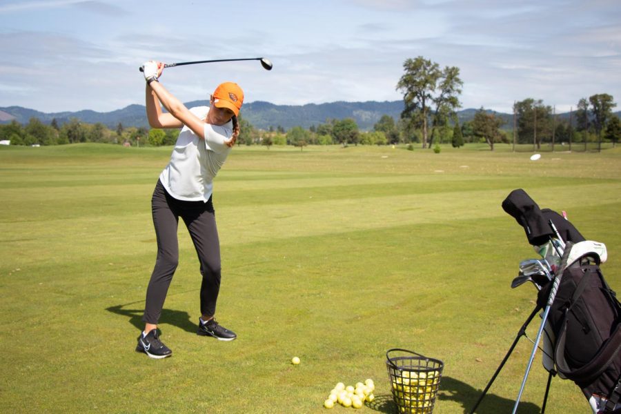 Ellie Slama, an Oregon State University golfer and senior, playing at the Trysting Tree Golf Course in Corvallis on May 23. Slama started playing golf as a child and completed her five years at Oregon State University with the best scoring average in OSU history at 72.95. Slama is graduating with a Bachelor of Science in Kinesiology.
