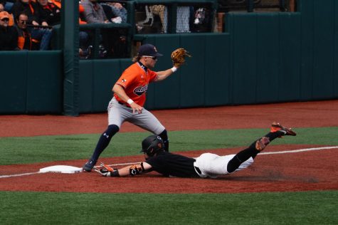 Justin Boyd slides into third with a triple in the final game of the Corvallis Super Regional at Goss Stadium on June 13, 2022.