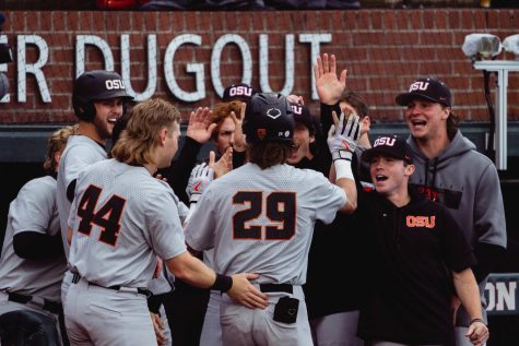 Jacob Melton celebrates a home run in the second game of the Corvallis Regional at Goss Stadium on June 12, 2022.