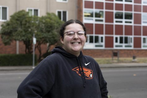Resident Assistant (RA), Emily Padrow (she/her), stands in front of her assigned hall, McNary Hall, on Sept. 15 in Corvallis, Ore. This is Padrow’s first year as an RA and the first time that the university has cut off admittance (admittance cutoff was May 1, 2022).