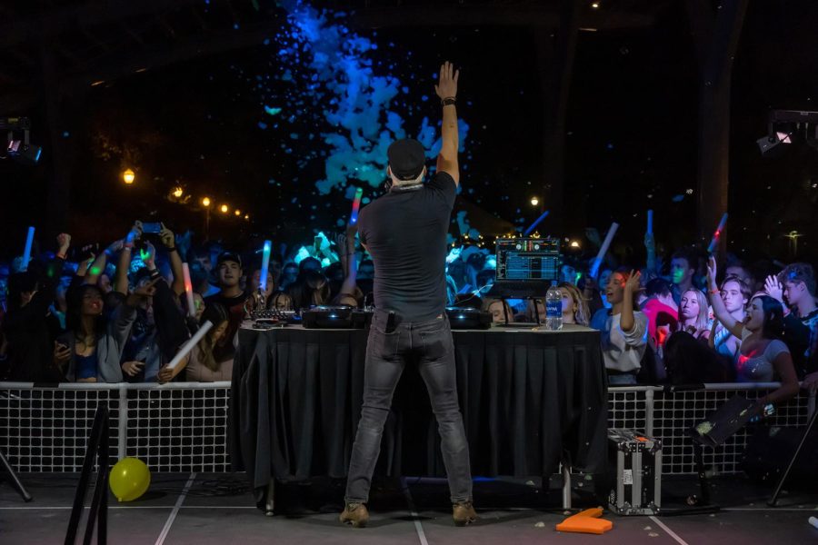 DJ, Blake Horstmann, performs for Oregon State University students at the “Afterglow” event in the Student Experience Center Plaza on Friday, Sept. 23. The event provided complimentary glow sticks for students to dance along with.