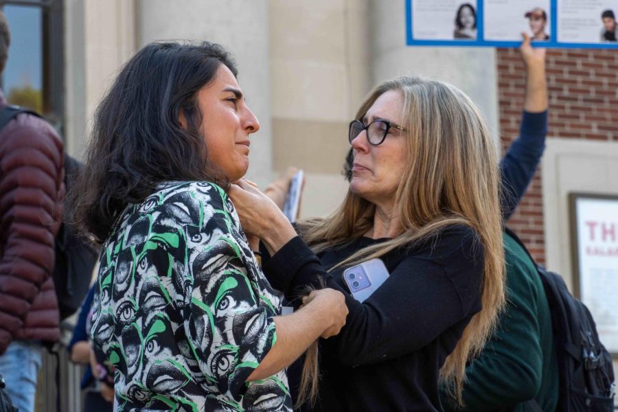 Two protestors cut their hair in front of the Memorial Union on Oregon State University campus on Monday. Cutting hair has
been used as a statement against oppression during the protests against the  Iranian government.