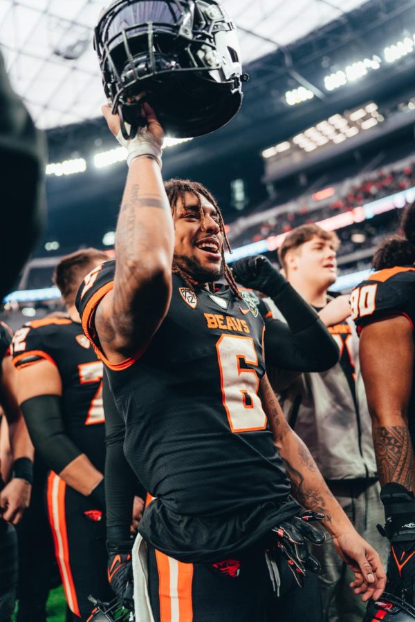 Damien Martinez raises his helmet in celebration after the Beavers victory over Florida in the Las Vegas Bowl at Allegiant Stadium on Dec. 18, 2022. The Beavers outscored the Gators 30-3.