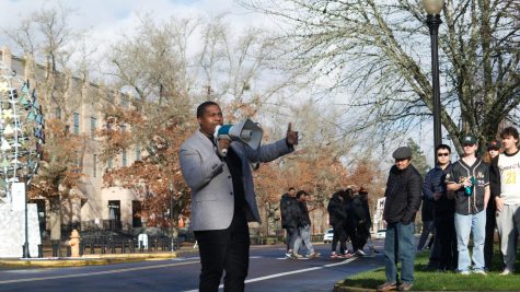 Jamar Bean, fraternity brother to M.L.K. Jr. and Director of the LBHBCC, leads the annual Peace March on Jan. 16 in front of the Alumni Center. He is joined at the front by fellow fraternity brothers of Dr. King from Alpha Phi Alpha.