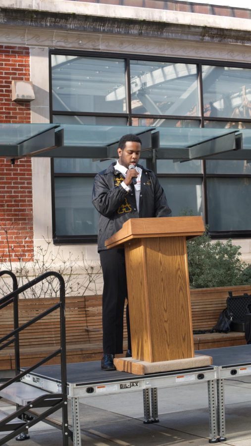 Fisal Osman, fraternity brother to M.L.K. Jr., speaks to the crowd gathered on Jan. 16 in front of the SEC. As he prepares to speak to the gathering of hundreds of people, his fraternity brothers get his attention with a practiced call-and-response that breaks the tension.