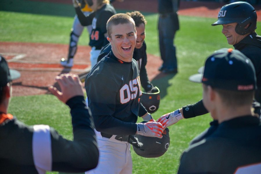 Freshman outfielder Gavin Turley celebrates his home run with his teammates after running the bases inside of Goss Stadium. Turley has totaled three hits so far this season.