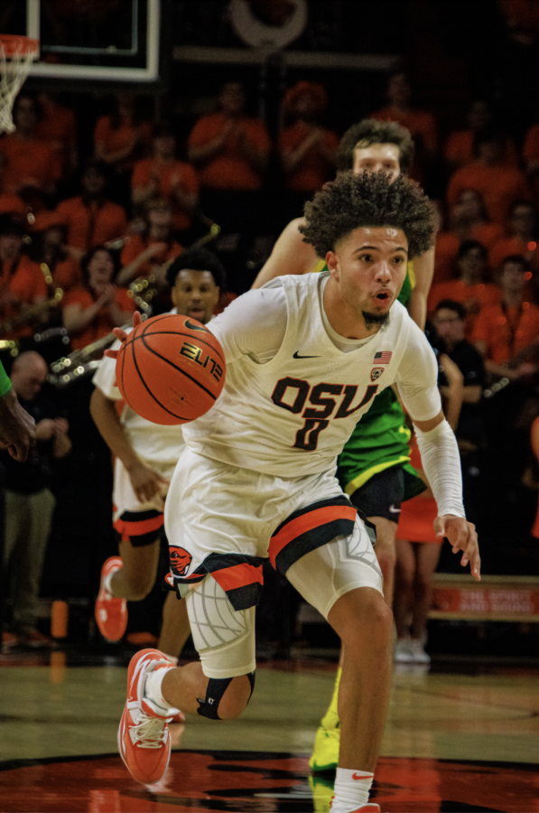 Freshman guard Jordan Pope drives past his Oregon opponent in the second half of the Rivalry Game inside of Gill Coliseum on Saturday night. Pope is averaging 12.5 points on a 43% shooting percentage.