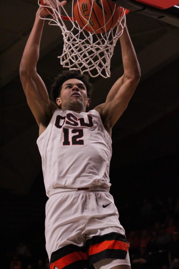Michael Rataj dunking for the final two points scored in the game against the California Golden Bears on March 4th at Gill Coliseum in Corvallis, OR. After being down for most of the game, the Beavers made a comeback, winning the game with a score of 66-69.