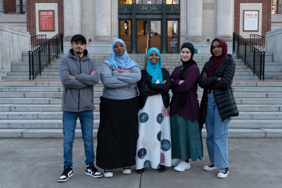 Vice President Abdullah Bedywi (left; he/him), President Fatima Rashid (she/her), Committee Chair Anisa Ali (she/her), Treasurer Denna Alnasser (she/her), Secretary Aya Ari (she/her) stand in front of the Memorial Union for a group photo on Feb. 24. The Muslim Student Association (MSA) dissolved in 2020 due to COVID-19 and has returned Fall Term 2022.