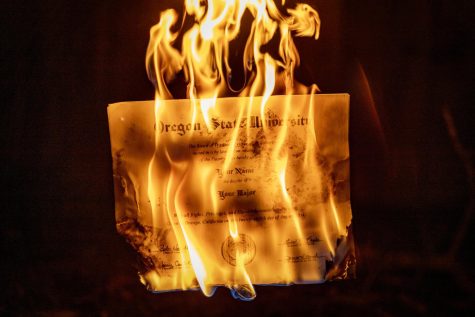 A photo illustration of a Oregon State University college degree burning on March 1. Questions are raised of whether a four year college degree is worth the debt that comes along with it in the face of an experience driven employment environment. 