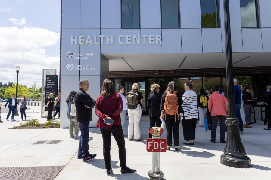 Tour members gather in front of the new Health Center located on the southwest side of campus on May 23. Being an upgrade from Plageman, the new health center will be the spot for students to be provided with a variety of health services with collaboration efforts from Samaritan Health Services.