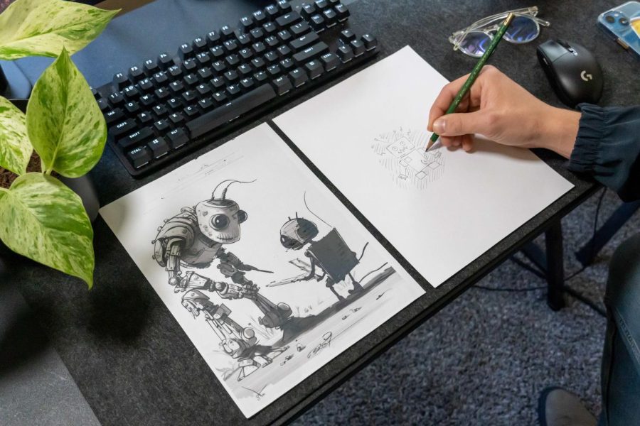  A photo illustration of an Ai generated image (left), and a hand drawn image, on April 24, in Corvallis. AI generated imagery can use text input to generate just about anything you could think of. 
