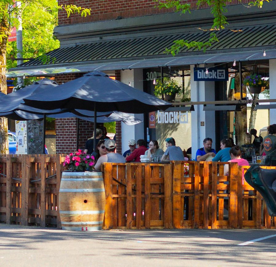 Many+people+attend+dinner+at+Block+15+in+downtown+Corvallis+on+May+28.The+additional+outdoor+seating+selection+was+extended+out+from+the+sidewalk+over+a+couple+of+parking+spots+and+is+expected+to+remain+in+that+state+over+the+summer.+