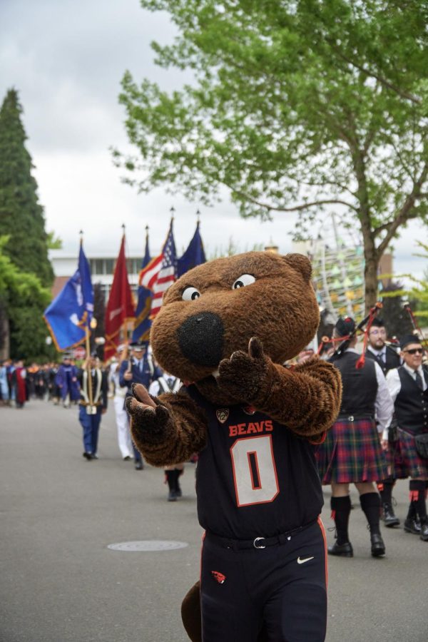 Benny marches with a procession following into Reser Stadium to kick off the 2023 OSU Commencement ceremony. With bagpipes blowing and military marching, the class of 2023 was led in style during this years ceremony. 