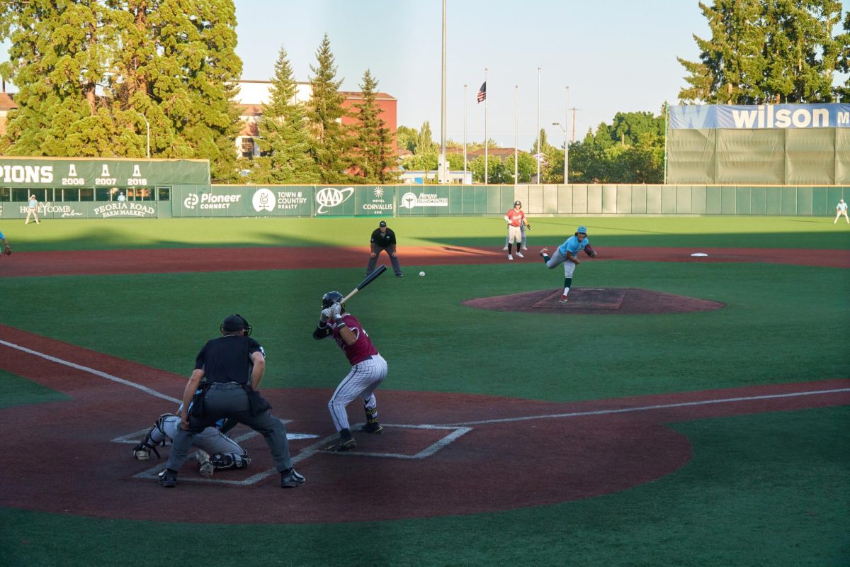 A Knights batter swings into a fastball thrown by a Pippins pitcher in a game at Goss Stadium on July 27, 2023. The Corvallis Knights secured an 8-2 victory over the Yakima Valley Pippins. 