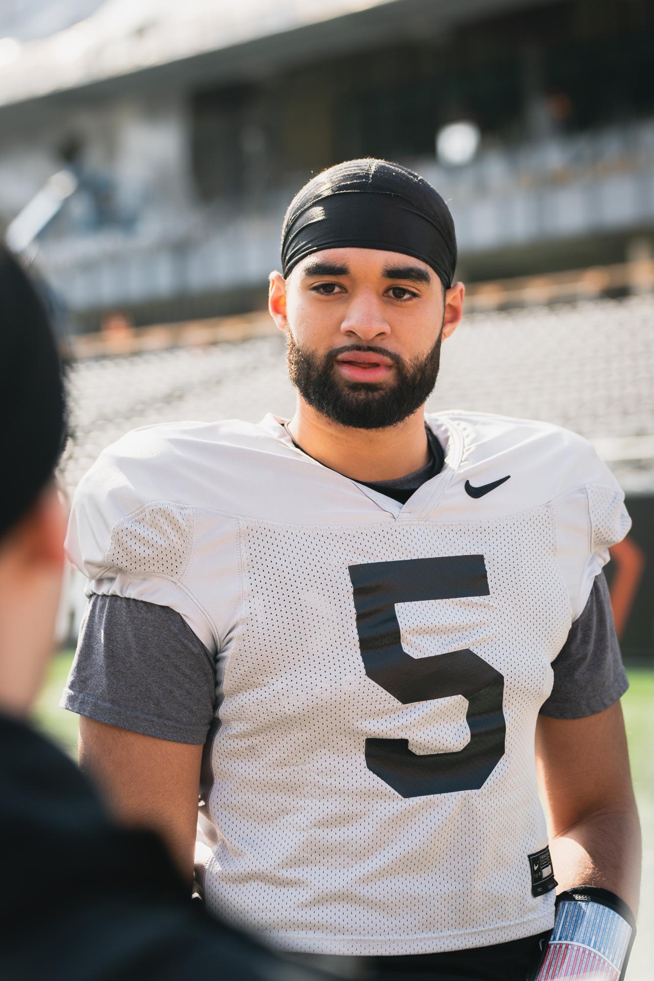 DJ Uiagalelei answers questions from reporters after the second spring practice of the 2023 season at Reser Stadium in Corvallis on March 16. Uiagalelei was drafted by the Los Angeles Dodgers in the 2023 MLB Draft.