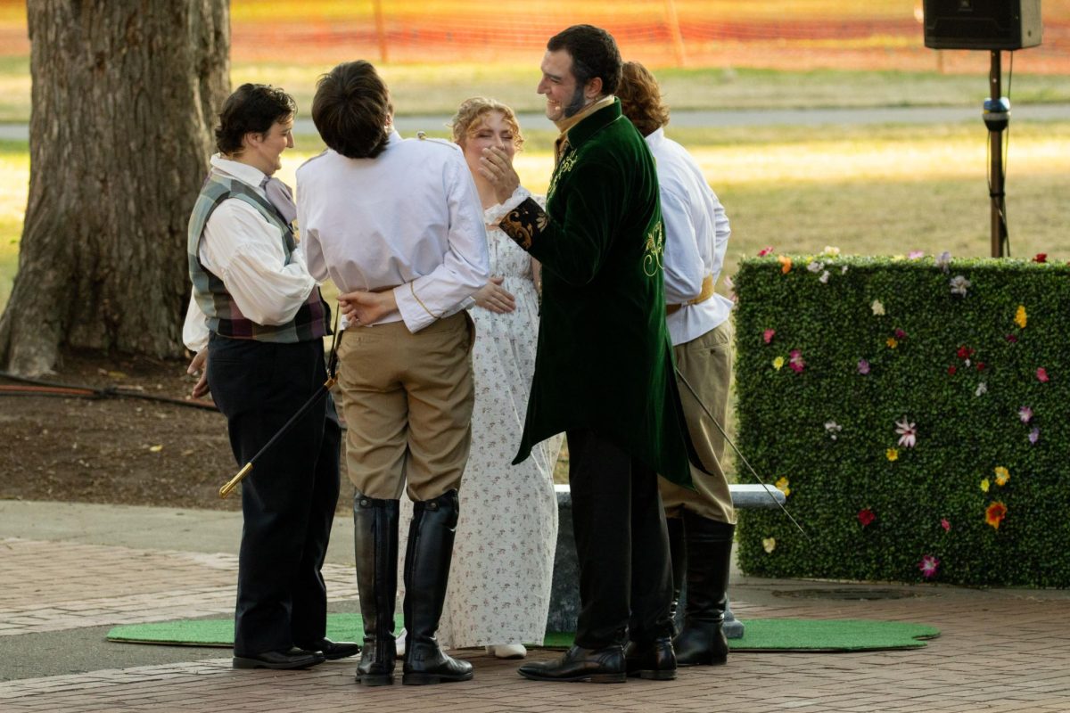 From left to right; AJ Glessner (Balthazar), Nick Sirianni (Don Pedro), Libby Brennan (Hero), Matt Holland (Leonato), and Nathan Hastings (Claudio) joke together during the first act of “Much Ado About Nothing” in the Memorial Union Quad on August 3, 2023.