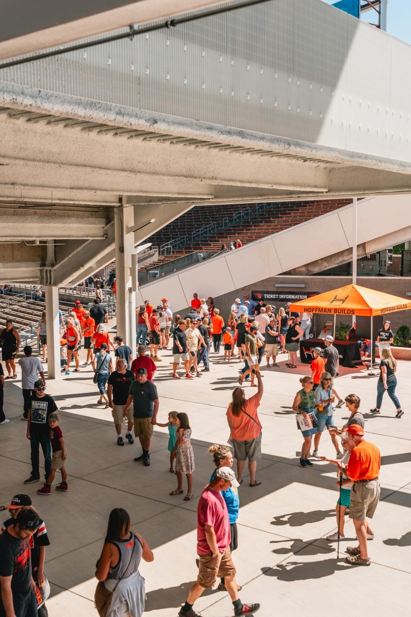 Beaver fans walk through the entrance to the new West Side of Reser Stadium in Corvallis on Aug. 21. The main walkway of the new stadium is known as Beaver Street, and allows spectators to view the game while they order concessions.