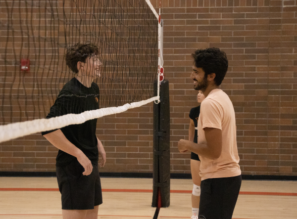Third-year Kinesiology major Zane Youngren (left) and fourth-year Mechanical Engineering major Kevin Sabbe (right) joke after a play during pickup at Dixon Recreation Center on August 8 2023. Both Sabbe and Youngren are members of Oregon State’s club volleyball team and speak highly of their experiences playing club sports.

