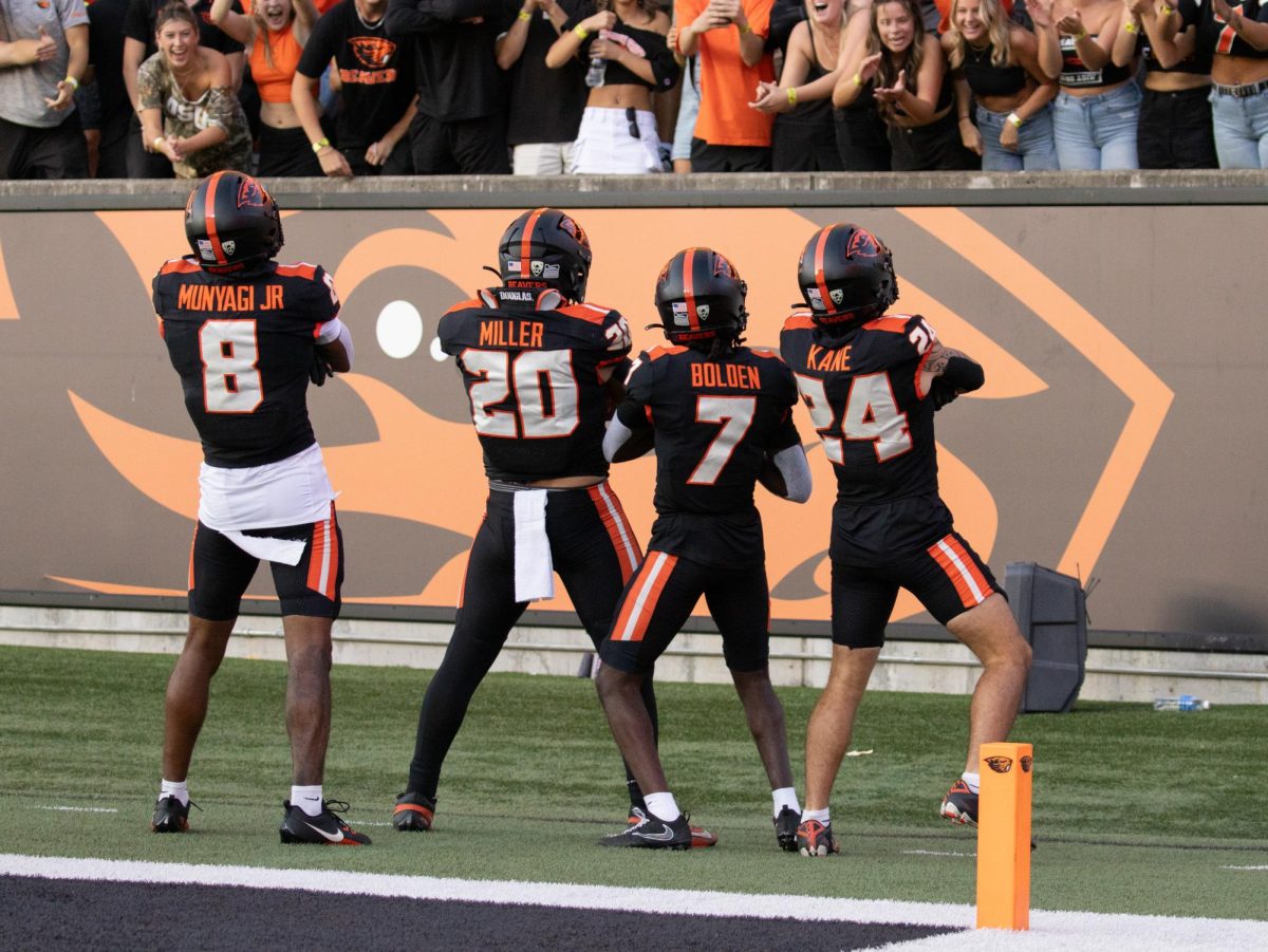 Oregon State Junior Wide Receiver Silas Bolden (#7) celebrates with teammates Redshirt-Sophomore Jack Kane (#24), Junior John Miller (#20), and Redshirt-Senior Rweha Munyagi Jr. (#8) after returning a punt 65 yards for a touchdown in Reser Stadium on August 9 2023. Bolden scored twice in the Beavers 55-7 victory over the UC Davis Aggies.
