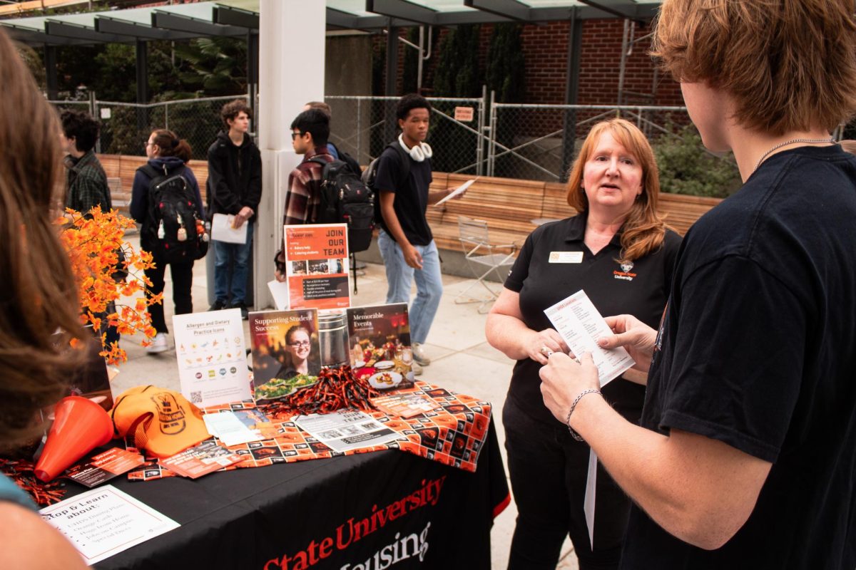 Assistant Director of OSU Dining Lisa Narrow (she/her) tells an OSU student about upcoming career opportunities at University Housing and Dining Services during the part time job fair on Oct 4, 2023 in the SEC Plaza on OSU campus.
