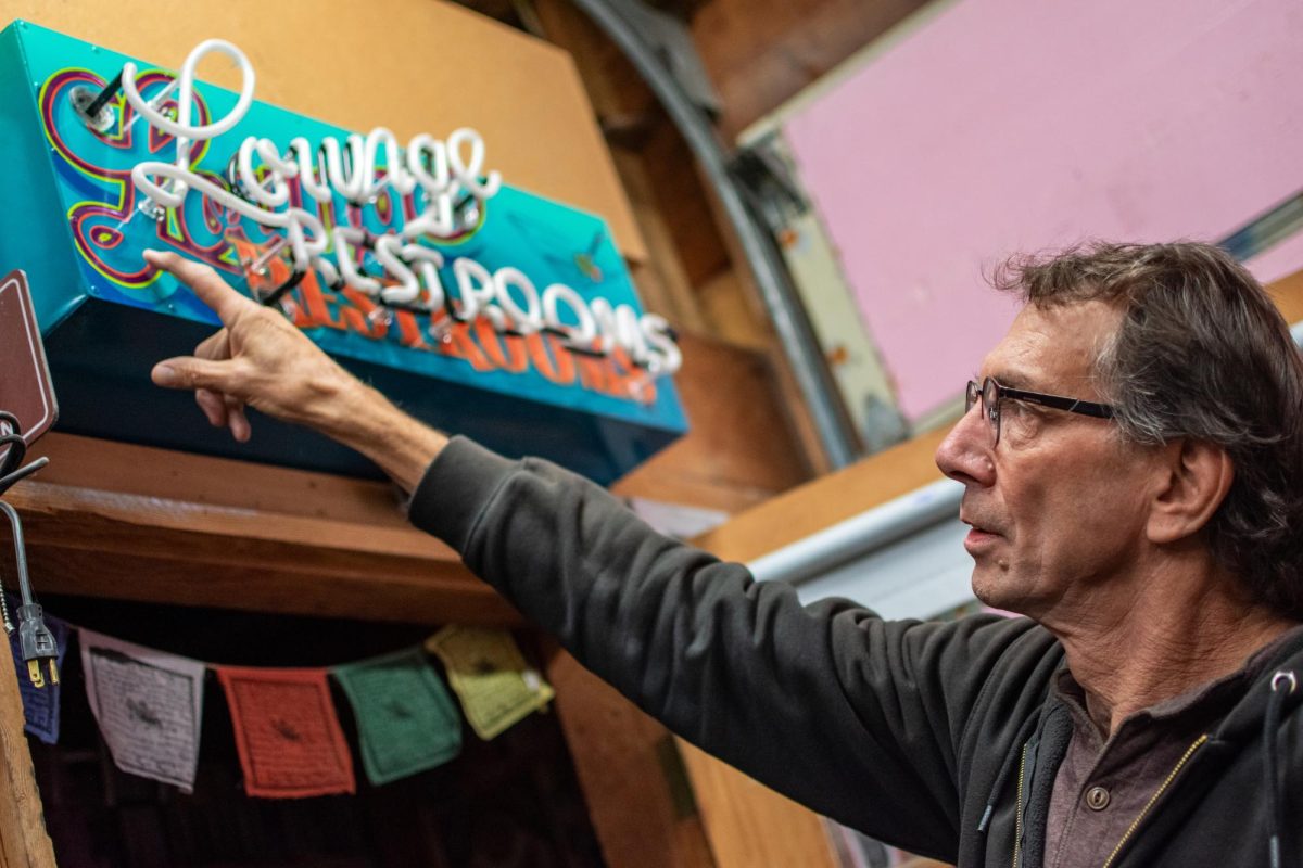 Brad Johnson discusses his experiences as a sign painter in his home shop in Corvallis on Oct. 2. Johnson has created many of Downtown Corvallis’ most iconic signwork, and continues to collaborate with signmakers around the world.